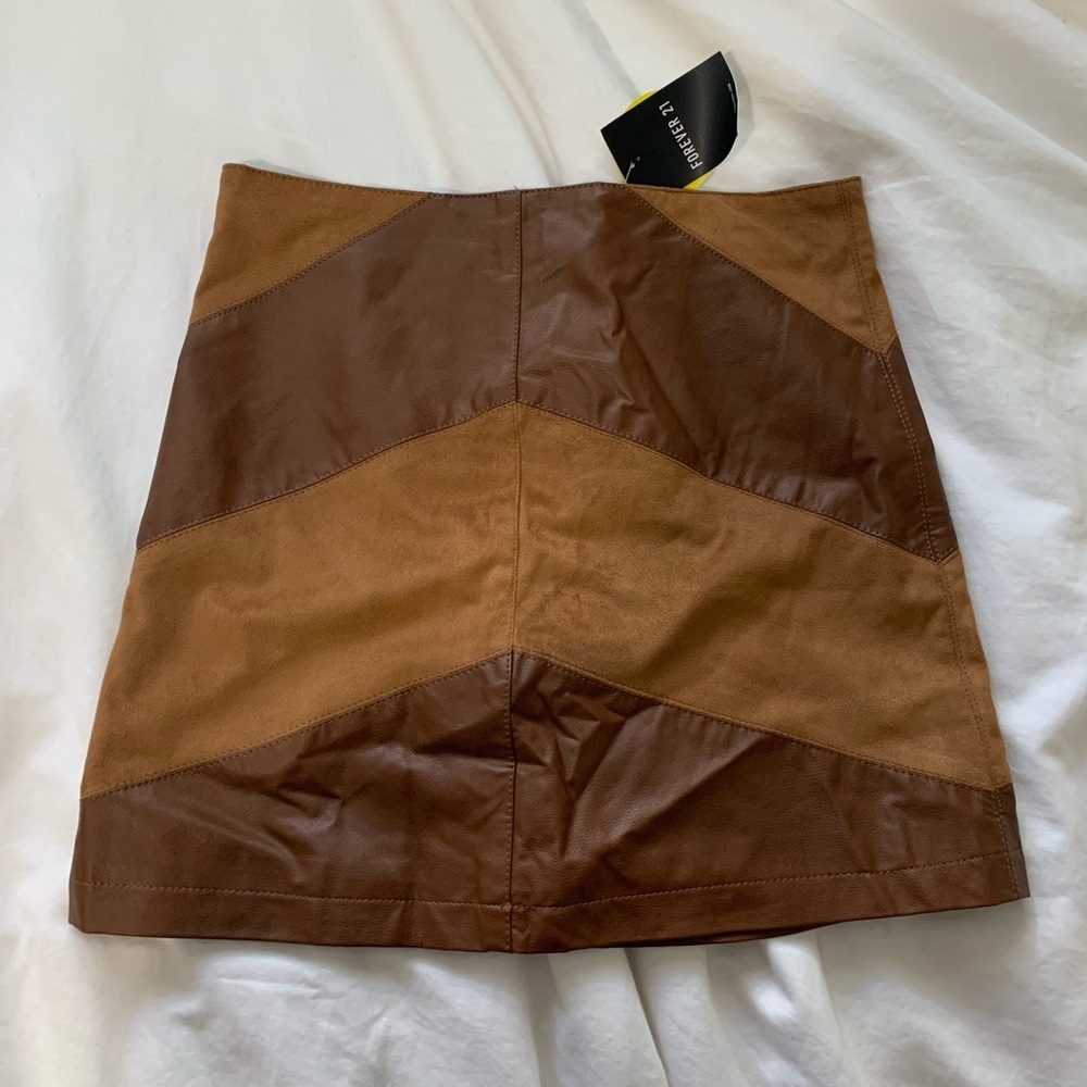 Faux leather and suede mini skirt
